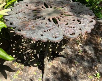 outdoor metal table with grape and flower design