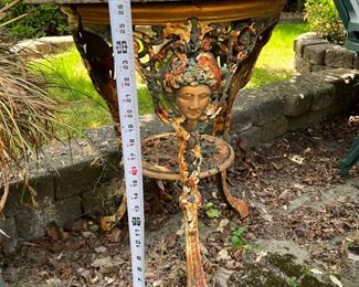 Outdoor art nouveau metal base table with stone top