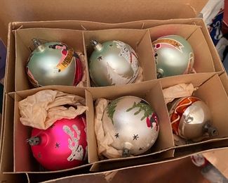 Boxes of antique Christmas decor throughout the house