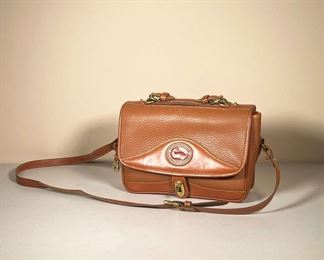 DOONEY & BOURKE BROWN LEATHER SHOULDER BAG | Dooney & Bourke All Weather Leather purse with leather straps. - Dooney & Bourke All Weather Leather purse with leather straps. - l. 11 x w. 3.5 x h. 28 in
