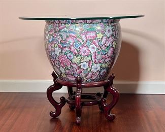CHINESE GARDEN URN TABLE | Large Chinese jardiniere / planter with allover enamel floral decoration and a fancy goldfish decorated interior, on a wooden stand with a 24" glass top to create a side table; stand 10" Diam. and 8" H. - h. 13 x dia. 14 in (Urn Only)