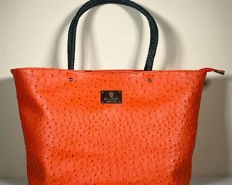 GUCCI OSTRICH BAG | Gucci orange ostrich leather purse with black leather handles and a large center pocket. - l. 16 x w. 4 x h. 12 in