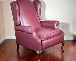MAROON LEATHER RECLINER | Having a tall back rest with carved claw foot legs in front, reclines with foot rest. - l. 36 x w. 32 x h. 43 in