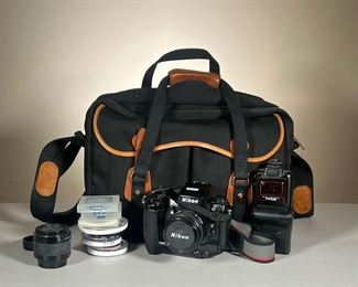 NIKON F4 FILM CAMERA WITH ACCESSORIES | Includes Nikon F4 film camera with multi-control back, 85mm lens attached, Nikon Teleconverter, Nikon Speedlight SB-24, and various other lenses & filters all-in high-quality camera bag. - l. 16 x w. 9 x h. 12 in (camera bag)