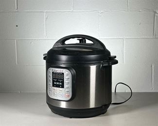 INSTANT POT PRESSURE COOKER | Includes 2 serving utensils, measuring cup, and steam tray. - h. 13 x dia. 13 in