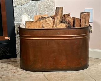 COPPER WASH BOILER | Copper Wash Boiler with brass handles, being used as a fireside wood/log holder. - l. 22 x w. 12 x h. 13 in