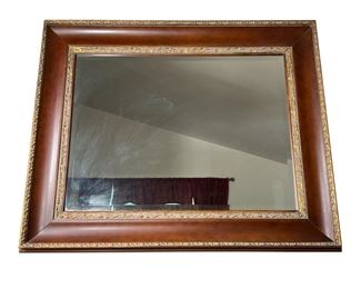 LARGE MIRROR | Large wall mirror with beveled glass, the frame in a dark brown finish with raised gold decoration. - l. 52 x h. 42 in