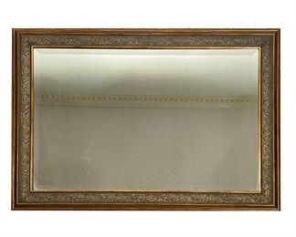 GOLD-FRAMED WALL MIRROR | Beveled glass mirror in a gold frame with flower design. - l. 41 x h. 29 in