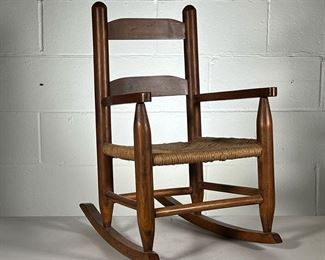 CHILD’S ROCKING CHAIR | Small child's chair with rush seat. - l. 14.5 x w. 20 x h. 23 in