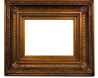 BURNISHED GOLD FRAME | Large carved frame in a burnished gold finish with wreath carved border. - l. 32.5 x w. 2.5 x h. 28 in