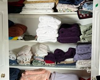LINEN CLOSET LOT | Contents of Linen Closet:
Features: towels, wash cloths, bedding, quilts, table cloths, napkins, place settings & more.