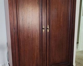 TV/armoire w/hanging rod and drawers. This is ONE PIECE, so please bring necessary help to move this item.