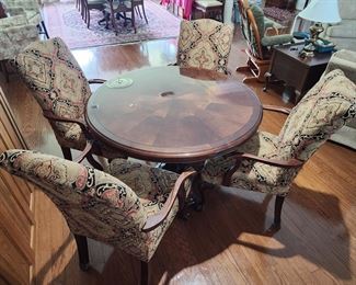 Gorgeous table w/four chairs. Chairs need to be reupholstered.