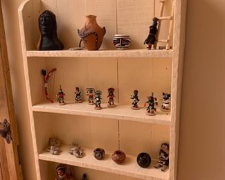 Shelf with kachinas and miniature pottery
