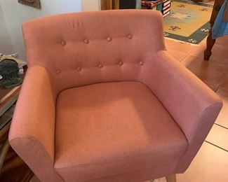 Coral swivel armchair