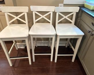 White wooden bar stools.  We have 8