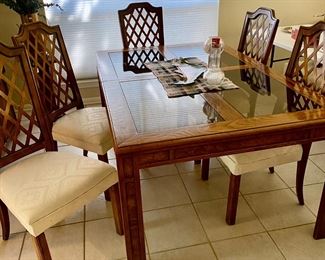 Lovely dining room table with smoke glass inserts, two leaves and 8 chairs, mint condition
