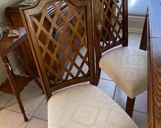 there are 8 chairs, two are arm chairs