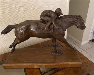  Lisa Perry of Springtown, Texas  Bronze Sculpture  This piece is titled The Payoff, sculpted in 1983, limited edition # 8 of 15. Her works sits in the Governor’s mansion in Kentucky.  It adorns the living rooms, mantels and dens of past presidents of the Jockey Club, the King Ranch and TTBA President Marshall Robinson.  It can be seen at the Kentucky Derby Museum, the Ranching Heritage Center an the Cowboy Artists of America Center and in front of the Ft. Worth Coliseum in the historical stockyards.    
She has been honored with the "Best of Show" awards at the National Cowgirl Hall of Fame, the Texas Women Western Artists show and the American Academy of Equine Art.  She won the best of show in metal sculpture at the Ducks Unlimited National Wildlife Art Show and has won the George Phippen Family award .  In 1985 she was given the Governor's Award for artist of the year in her home state of Montana.  In 1991 she was presented the Founders Award at the American Academy of Equine 