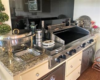 There are many great serving containers in this grilling kitchen in the sunroom.