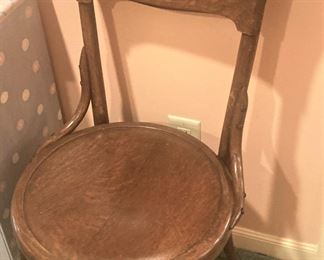 One of two vintage wooden chairs
