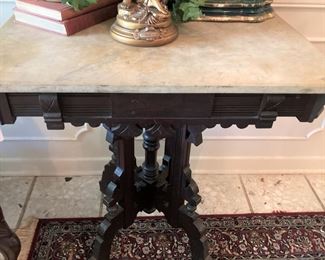 Marble top Eastlake table with beautifully carved legs