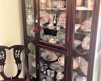 Lovely display cabinet filled with hand-painted china