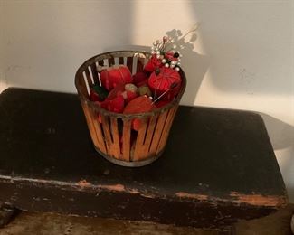 Antique berry basket filled with emeries