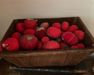 Small wooden tote filled with pincushion tomatoes 
