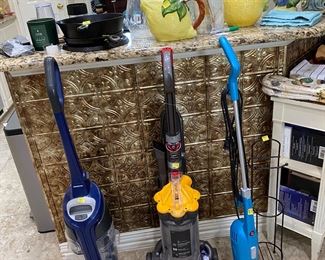 3 vacuum cleaners and 5 iRobot vaccums