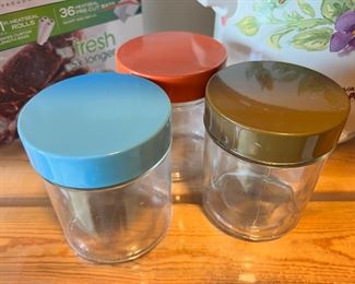 Set of Three Glass Canisters with Blue, Red & Brown Lids