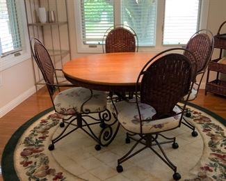 Kitchen table and 4 chairs on wheels; round area rug, corner metal shelf