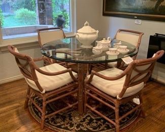 McGuire round rattan glass top table and four arm chairs