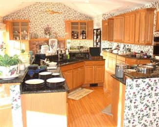 This huge kitchen is full of clean, like new items.