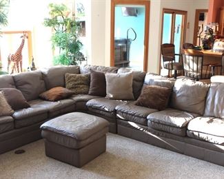 Very good condition leather sectional sofa.  The bar chairs in the background are not for sale.