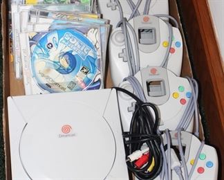 Sega Dreamcast console, controllers and games.  