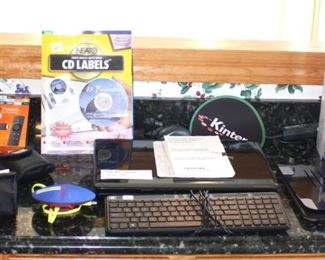 Desk area has a Toshiba laptop, Brothers Fax machine, three binocular sets, and electronics.