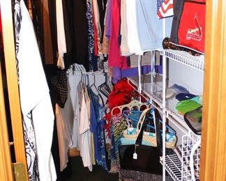 Lots of ladies' clothing, purses, scarves and shoes.