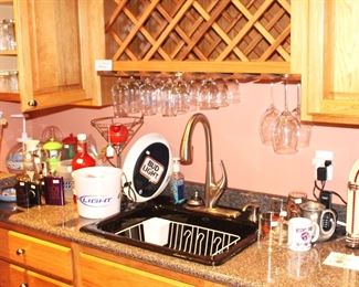 Bar area is full of glassware and bar items.  