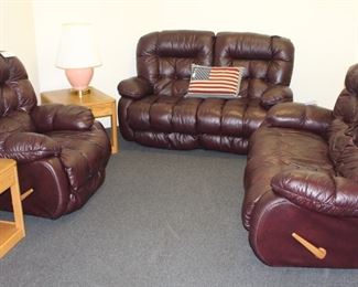 Leather recliner and love seat recliners with end tables.