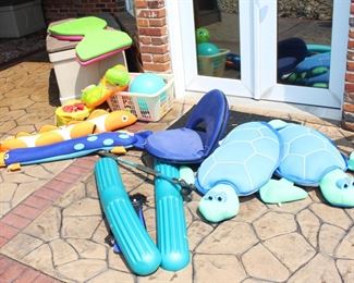 Variety of swimming pool toys and floats.