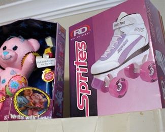 Pink skates, boxed toys