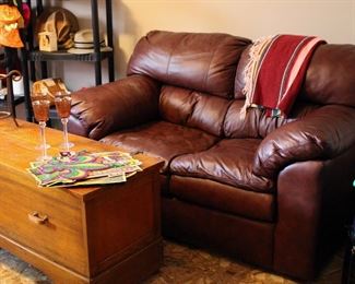 Brown leather loveseat