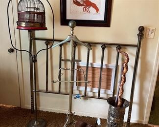 bird cage, brass valet, brass bed