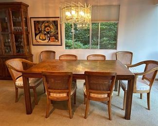Henredon Table and 8 chairs  Measures: 66 inches long X 42 inches wide PLUS 2 leaves at 22 inches wide each