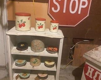 Metal tins, images on wood plates, stop sign (bookcase is sold)