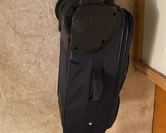American Tourister Navy Blue Bag with Large Wheels for easy rolling (large wheels shown)