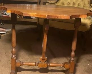 Tilt top table - top tilts and can be put against the wall to save space when not in user