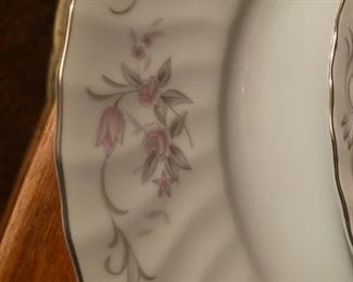 Detail of the pattern which is silver with delicate pink flowers