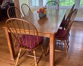 Solid wood table 65" by 39.25", also a 12" leaf
